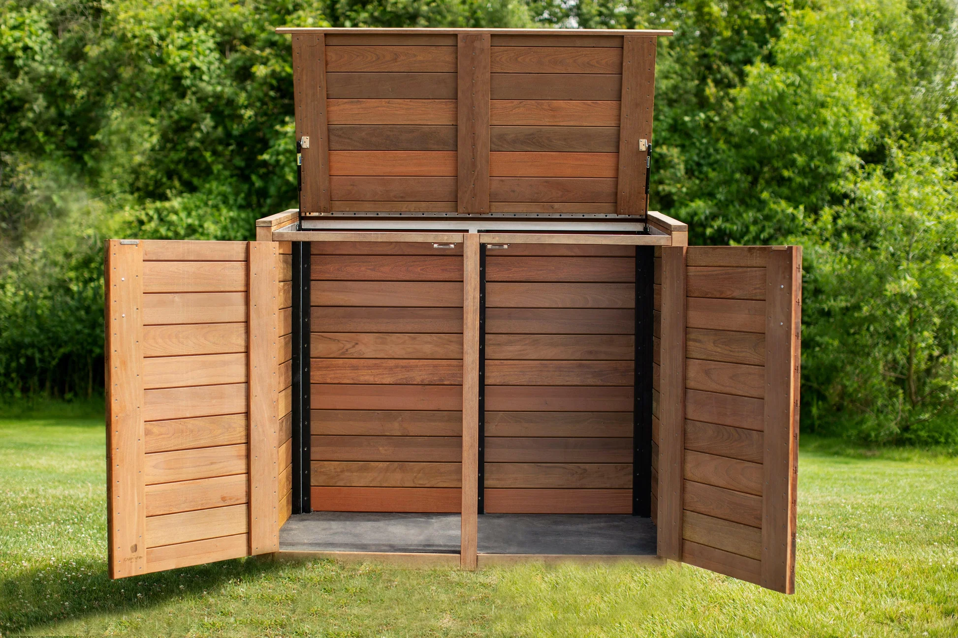 A real outdoor trash can with a tight lid placed beside a patio with potted plants, clean and well-maintained yard photo